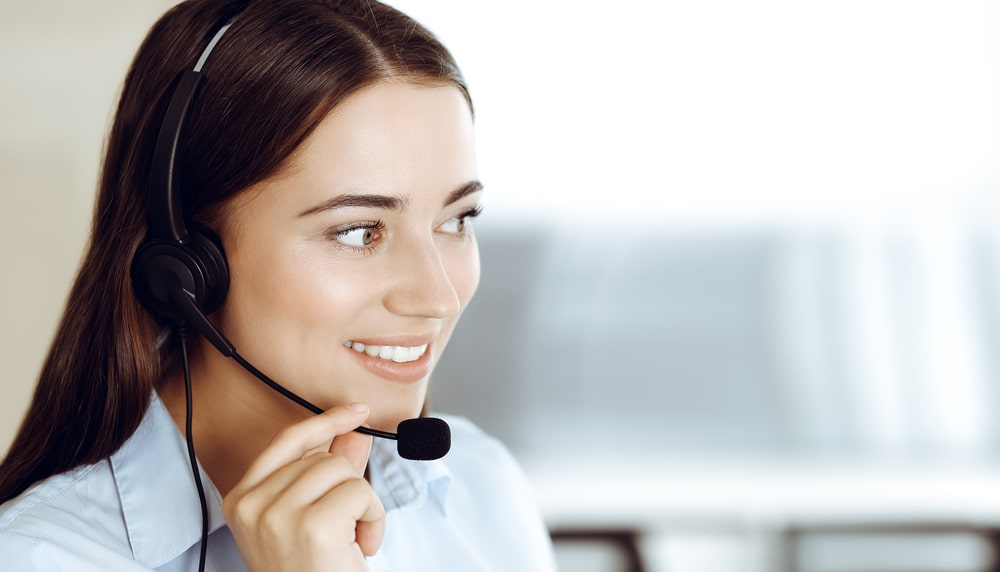 Brunette,Female,Customer,Service,Representative,In,A,Headset,Is,Consulting Phone operator Chicago Website Design SEO Company